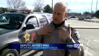 Deputy saves baby's life on hood of his squad car