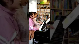 Chinese cute girl play piano