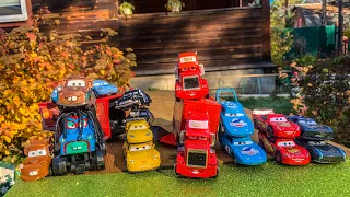 Disney Pixar Cars fall into the water: Lightning McQueen, Mater, Jackson Storm, Natalie Certain