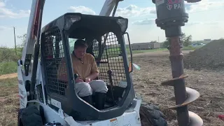 First time using a Bobcat with hydraulic auger