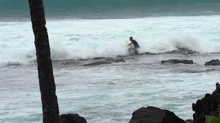 Surfer slams on the dry reef, Big Island, Hawaii. Luckily he survived!