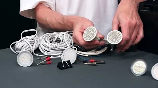 LED lighting on a fishing trip in a tent with his hands