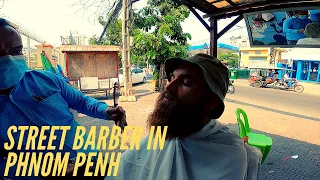 Cambodian street barber in Phnom Penh and the Royal Palace.