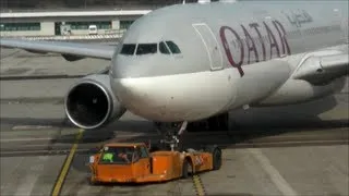 Airbus A330. Qatar Airlines. Pushback at Airport Gate. Milano Malpensa. Italy