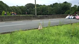 Reeves and Birchall clash at the 2017 Isle of Man Southern 100 sidecar race.