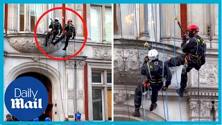 Moment ex-special forces soldiers abseil off roof to kick out squatters in London