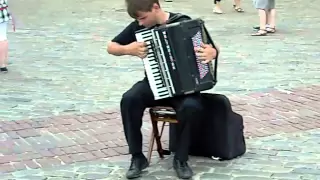 Street artist playing Vivaldi on accordion