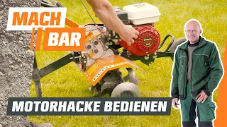 Motorhacke bedienen und Boden auflockern | OBI