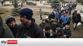 Ukraine Invasion: Volunteers queue to join Ukrainian army