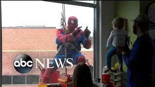 Window-washing superhero team brings smiles at children's hospital
