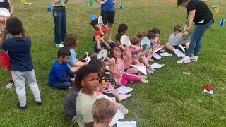 Students and staff at Reilly Elementary School watch the solar eclipse begin in Austin.