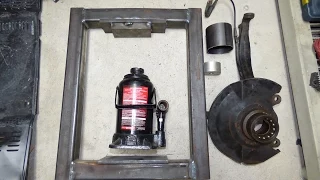 homemade shop press removing front wheel bearings
