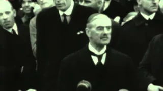 Neville Chamberlain returns from Germany with the Munich Agreement