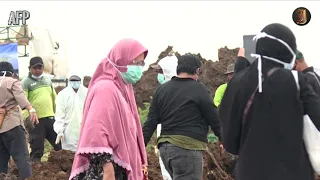 Indonesia creates hundreds of makeshift gravesites, inches apart, to deal with soaring Covid deaths