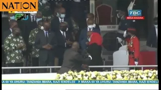 Uhuru greets her host President Samia Suluhu at Tanzania's Independence Day fete