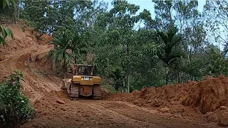 Heavy Equipment Bulldozer Cat D6R XL Working on Leveling Cliff Land