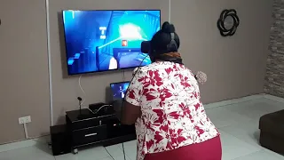 Mom plays Beat Saber