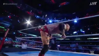 Batista tripping over the rope