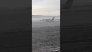 De Havilland Canada DCH8 Q200 taking off and disappearing into fog at Canberra YSCB airport #q400