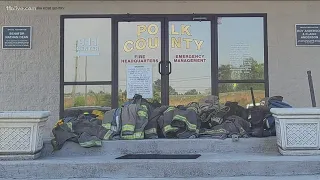 Group of volunteer firefighters walk off job