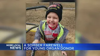 A somber farewell for young organ donor