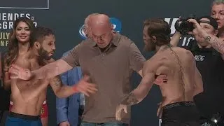 Conor McGregor and Chad Mendes weigh in for UFC 189