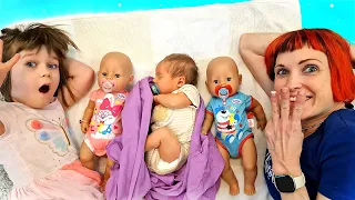 Kids pretend to play with baby dolls & baby born doll. Family fun video for kids. Baby videos.