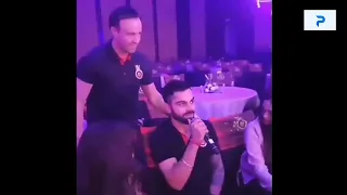 Virat kohli singing a song in a show