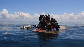 Indonesian authorities rescue stranded Rohingya holding onto overturned boat | AFP