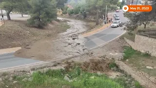 Floodwater blocks road in Spain amid rain warning