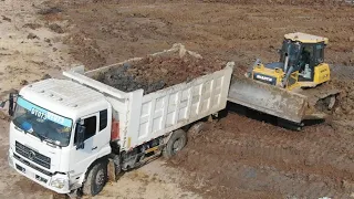 New SHANTUI Bulldozer filling mud on the lake & Dump truck 25 Unloading