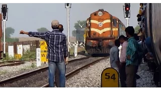 Stupid guy asking LIFT with a speeding train : Indian railways !!