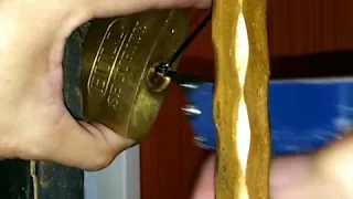 Unlocking padlock with a pick gun