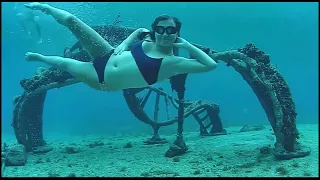 Cute Girl Swimming Underwater in Cozumel