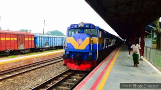 Dhumketu Express Train slowly entering Ullapara railway station of Bangladesh railway .