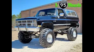 Massive 1983 GMC Jimmy on Super Swampers at I-95 Muscle