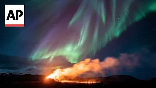 Northern Lights shine over Iceland's erupting volcano