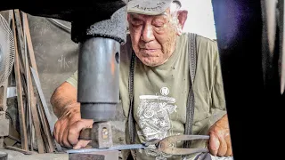 A day in the life of a blacksmith, guarded by an 89-year-old super grandfather and his family.