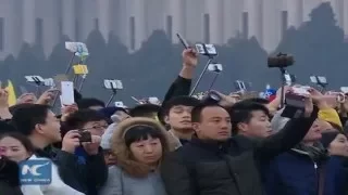 RAW: Thousands watch new year flag raising at Tian'anmen Square