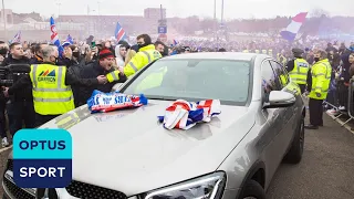 WILD SCENES! Steven Gerrard's car mobbed by Rangers fans, policeman gets knocked down outside Ibrox