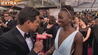 Oscars 2014: Lupita Nyong'o Talks Prada Gown on the Red Carpet