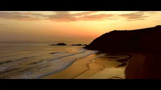 SUNRISE on the BEACH from a DRONE