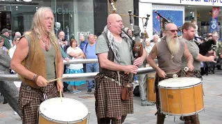 Scottish 'tribal' pipes and drums from Clanadonia, playing 'Tu-Bardh' in Perth City centre, Scotland