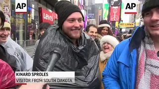 People pack into Times Square for rainy New Year's