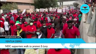 NDC supporters walk to protest E-Levy