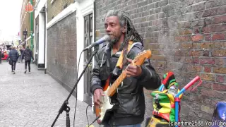 London Street Music from Jamaica. Reggae Guitarist and Singer in Brick Lane
