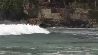 Surfing Mirissa beach in Sri Lanka.