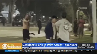 Street takeovers flood streets of Orange County; man confronts crowd armed with weapon