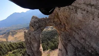 Wingsuit Pilot Flies Through Hole In Rock