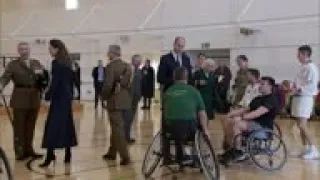 Charles helps William play wheelchair basketball